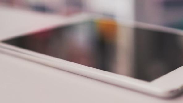 Image of a tablet on a white table