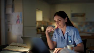 Banner of nurse at a computer