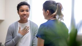 A doctor holding a consultation.