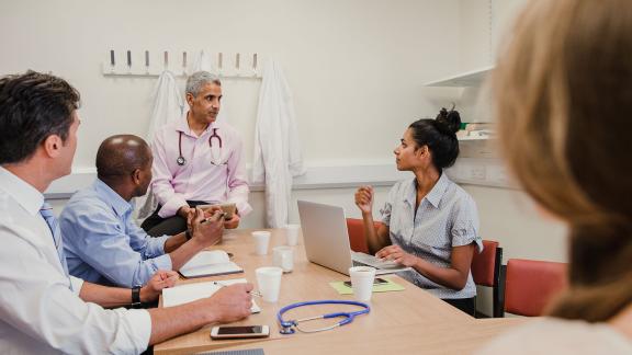 A diverse meeting of doctors.