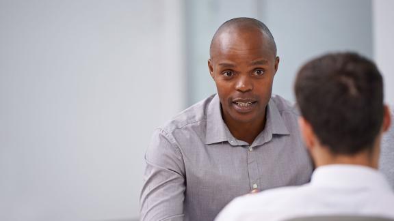 Two office workers having a meeting.