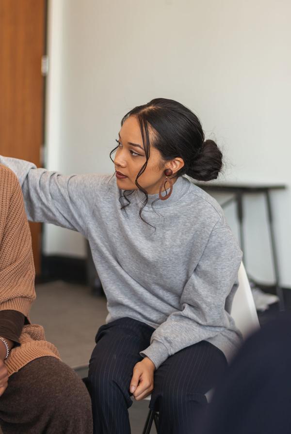 One patient comforts another in group counselling